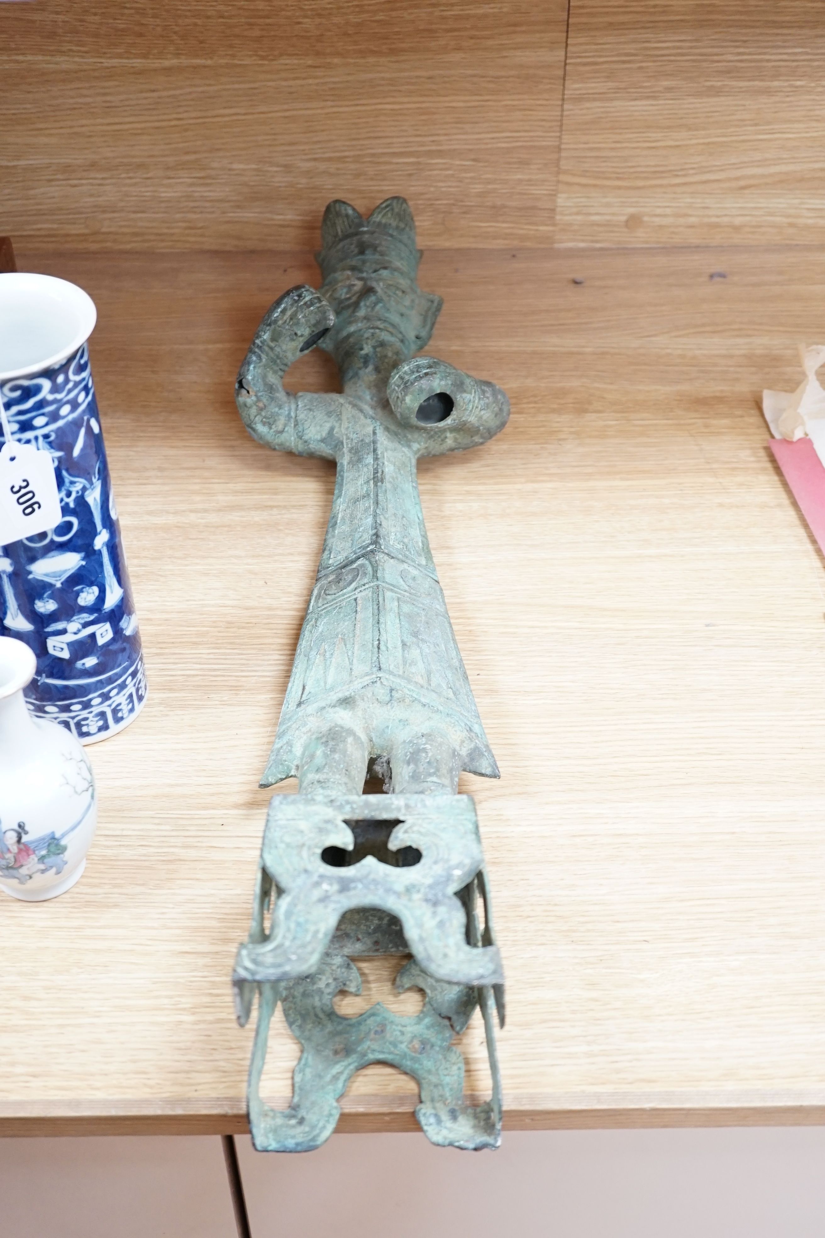 A large, archaic tic bronze figure, 76cm, and a bronze bell on chain